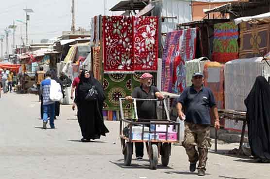 Iraq market blast kills at least 21, wounds 33